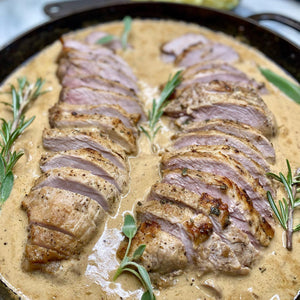 Herb Roasted Pork Loin with creamy white wine sauce.